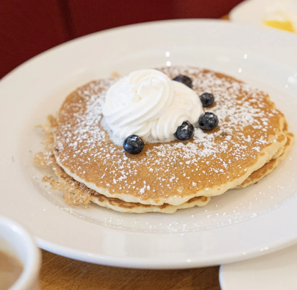 pancakes with blueberries and whipped cream on top from box lunches Seattle