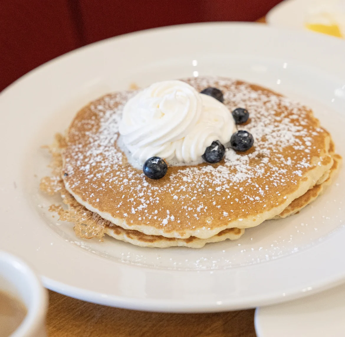 pancakes with blueberries and whipped cream on top from box lunches Seattle